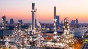 Aerial view of oil refinery during sunrise.