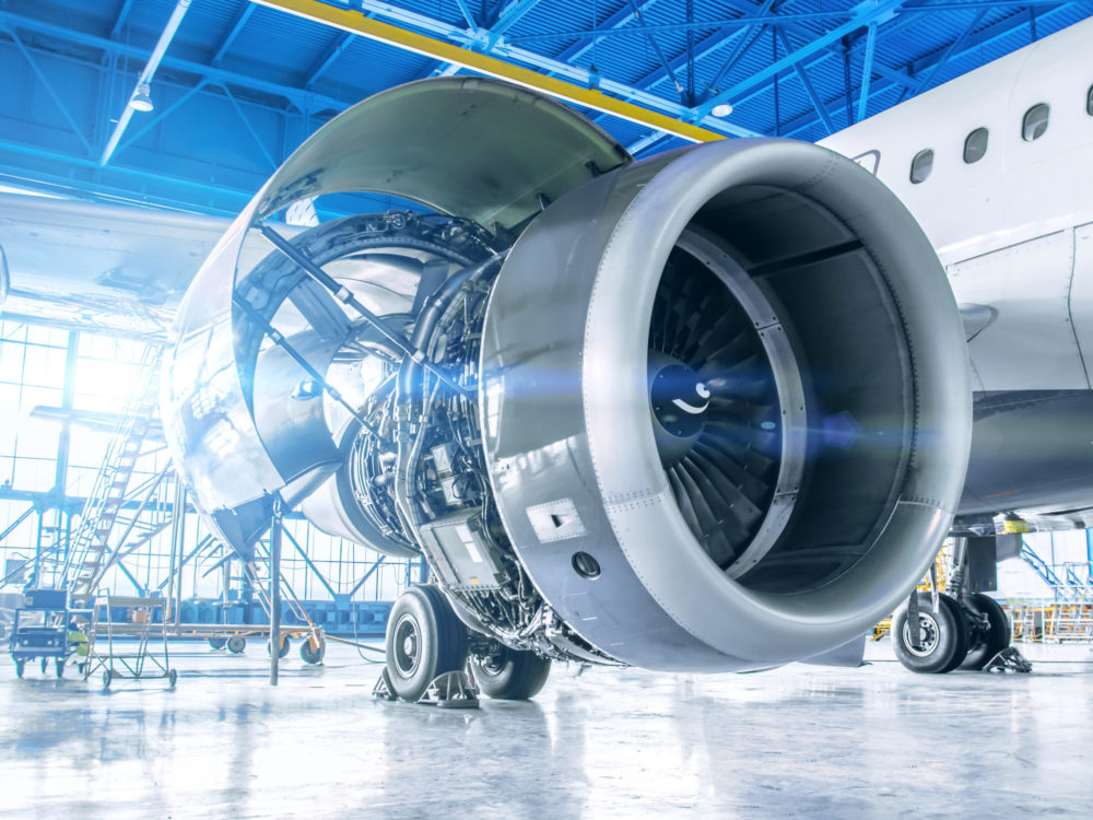 Industrial theme view. Repair and maintenance of aircraft engine on the wing of the aircraft