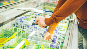 man-get-frozen-food-from-fridge-in-store